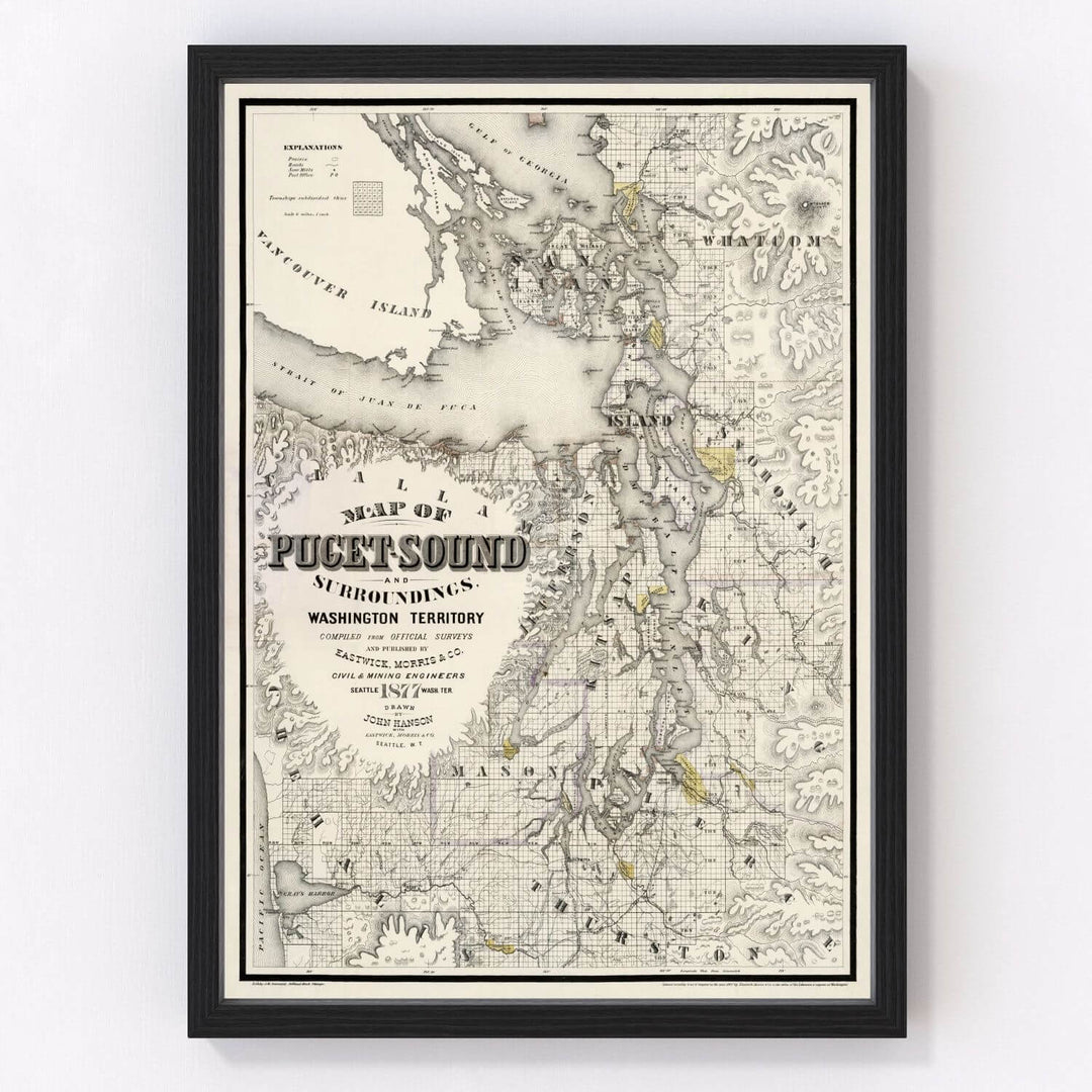Antique Map of Seattle, Washington from 1877 framed on a wall, showcasing 19th-century cartographic details of the Washington Territory.