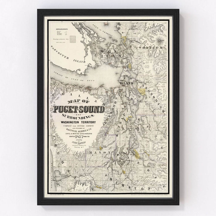 Antique Map of Seattle, Washington from 1877 framed on a wall, showcasing 19th-century cartographic details of the Washington Territory.