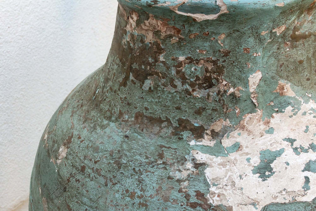 Close-up of Antique Mediterranean Terracotta Pottery Vessel showing weathered texture and coastal elegance.