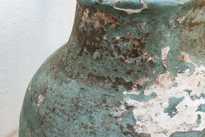 Close-up of Antique Mediterranean Terracotta Pottery Vessel showing weathered texture and coastal elegance.