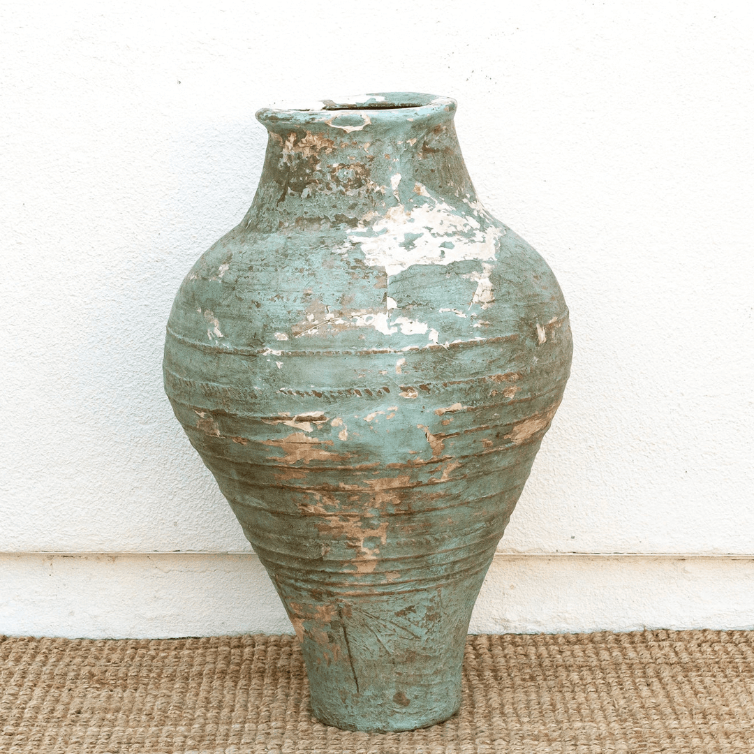 Antique Mediterranean Terracotta Pottery Vessel showcasing timeless craftsmanship and coastal elegance on textured background.