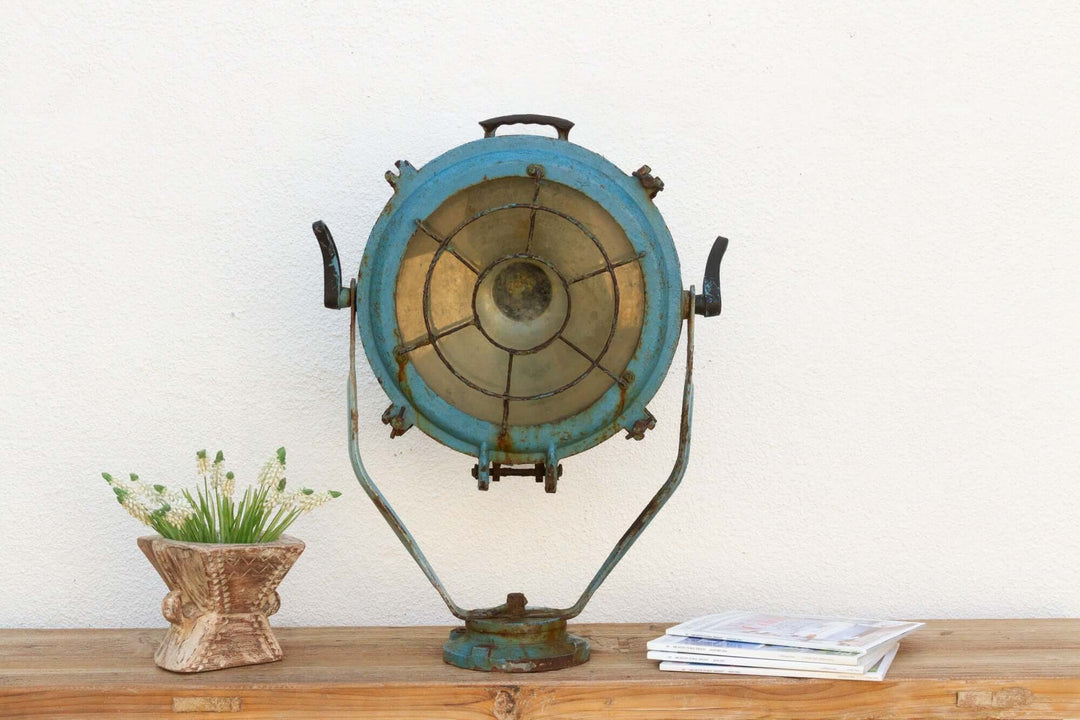 Antique Nautical Ship Spotlight with vintage blue metal design, showcasing maritime industrial elegance on a rustic wooden shelf.