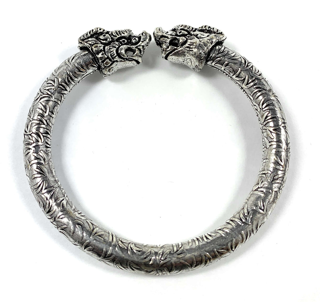 Antique Norse Viking Cuff Bracelet with Lion Heads in silver, showcasing intricate craftsmanship and historical design influence.