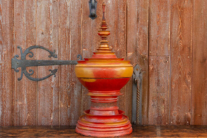 Antique Shan-Style Burmese Temple Vessel, 19th-century offering vessel with stupa-like design on wooden background