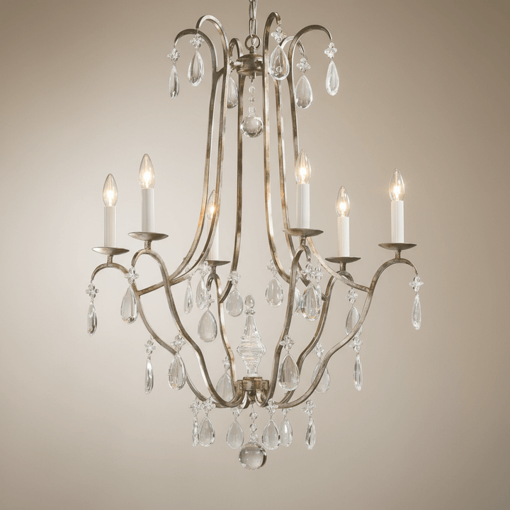 Antique Silver Leaf Italian Chandelier with Crystal Drops illuminated against a neutral background