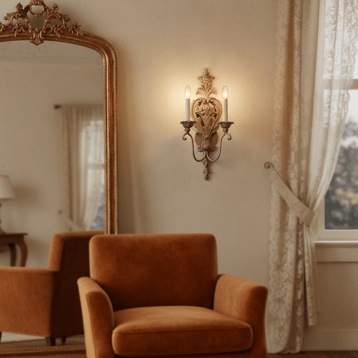 Antique Silver Leaf Italian Wall Sconce illuminating a cozy living room with vintage decor.