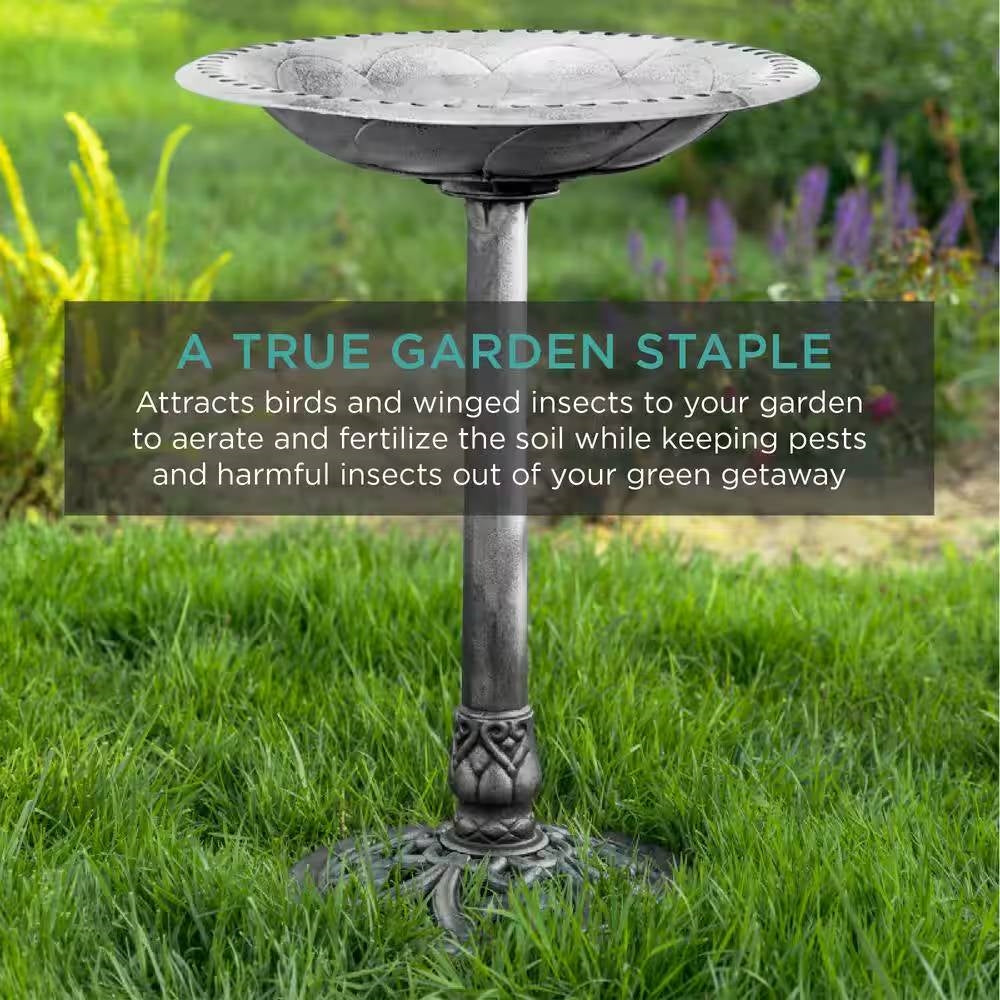 Antique Style Silver Bird Bath in a green garden, highlighting rustic aged silver finish for outdoor decoration and wildlife attraction.