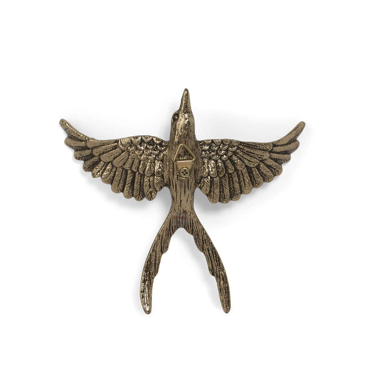 Antiqued Gold Flying Bird Wall Art Sculpture gracefully depicted in flight with detailed wings.
