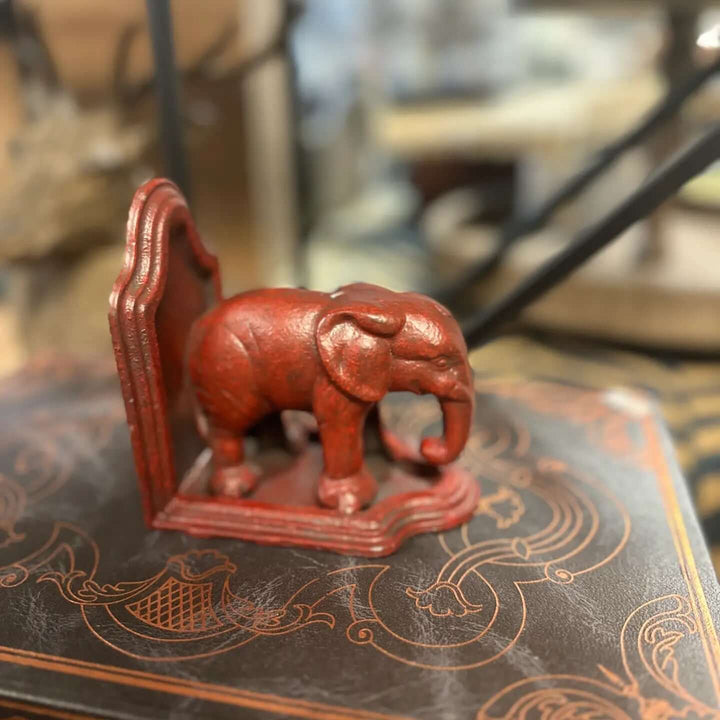 Single antiqued red elephant bookend product view