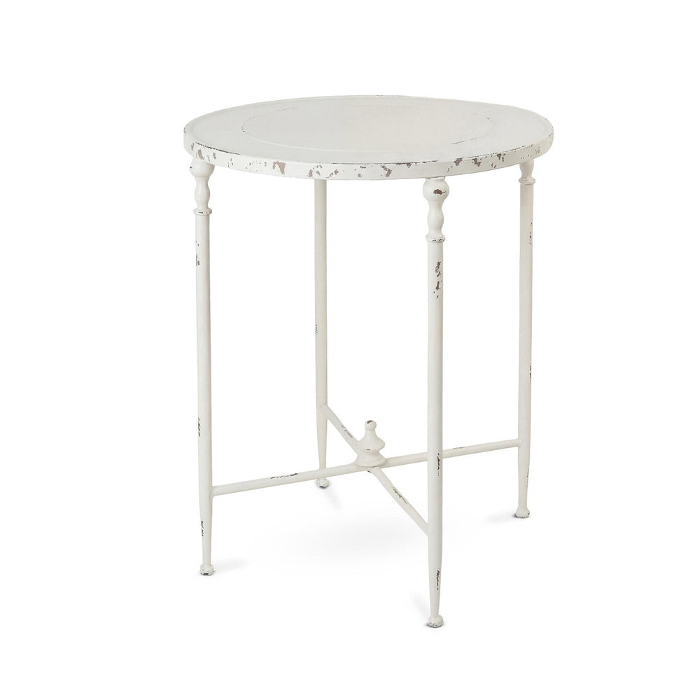 Antiqued white iron round side table with slender decorative legs, a raised tabletop edge and cross-braced base.
