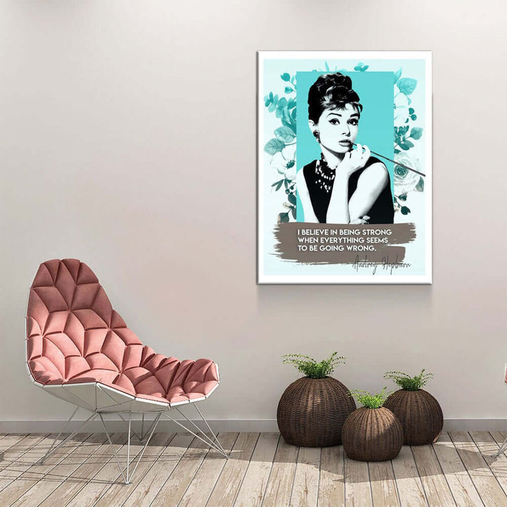 Audrey Hepburn Quote Canvas Wall Art displayed above a modern chair in a stylish room, featuring Hepburn's image and empowering quote.