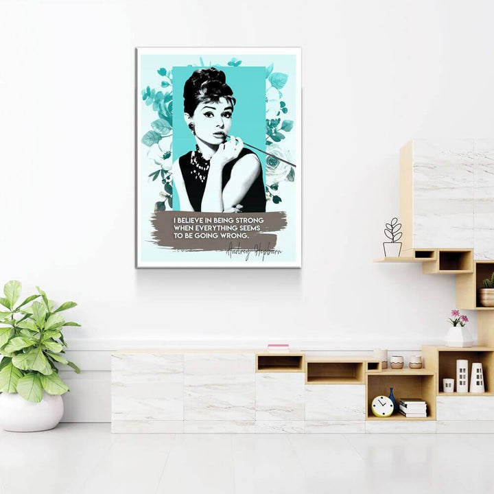 Audrey Hepburn Quote Canvas Wall Art featuring an empowering quote and iconic image in a stylish modern room setting.