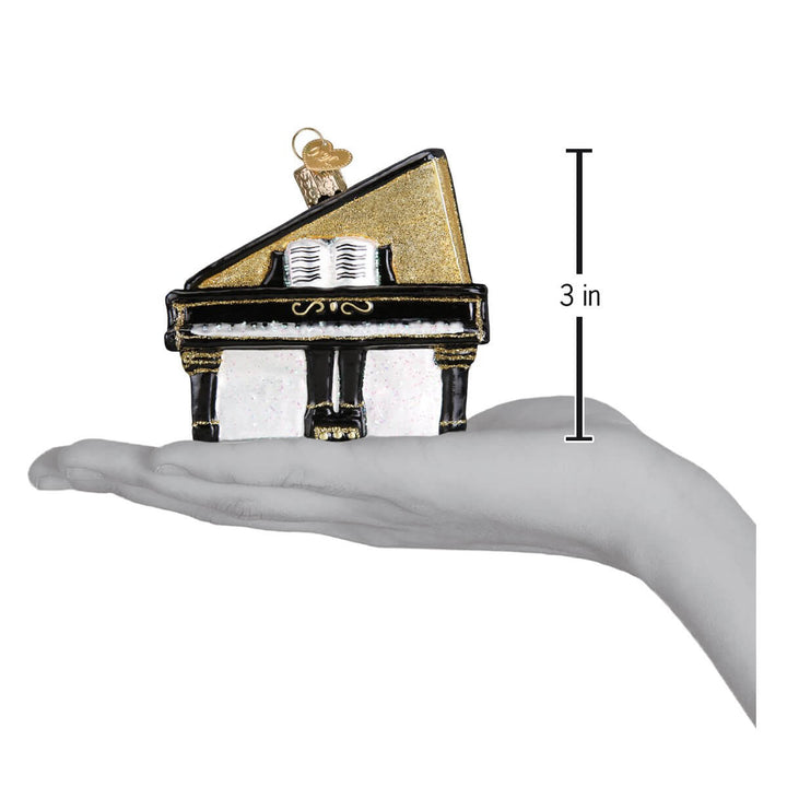 Baby Grand Piano Christmas Ornament held in hand illustrating elegance and tradition, 3 inches in size.