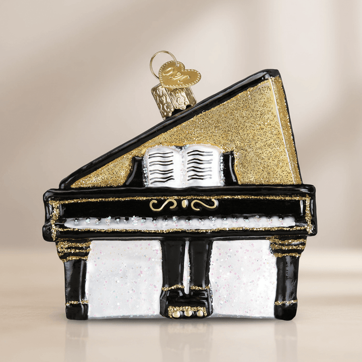Elegant Baby Grand Piano Christmas Ornament with gold accents and musical notes, perfect for adding timeless charm to holiday decor.
