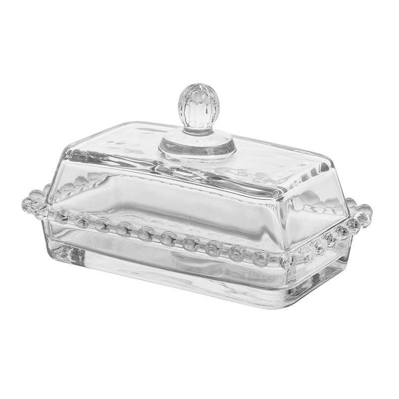 Beaded glass butter dish with faceted knob on a white background