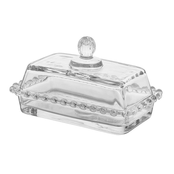 Beaded glass butter dish with faceted knob on a white background