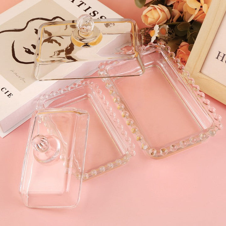 Open large and small beaded glass butter dishes