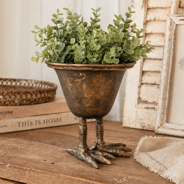 Bird Claw Metal Pedestal Planter styled beside books
