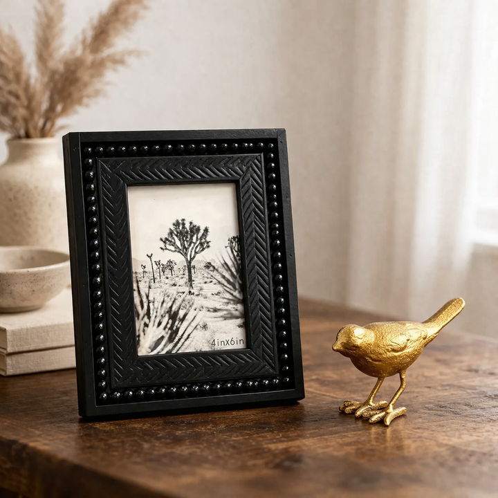 Single 4x6 black wood frame displayed beside a gold bird figurine
