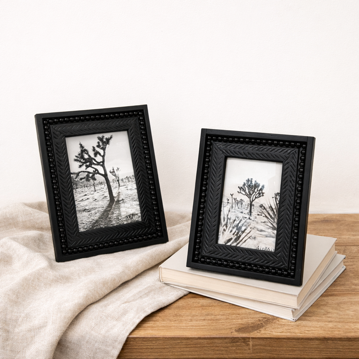 Both black picture frame sizes styled over pale books