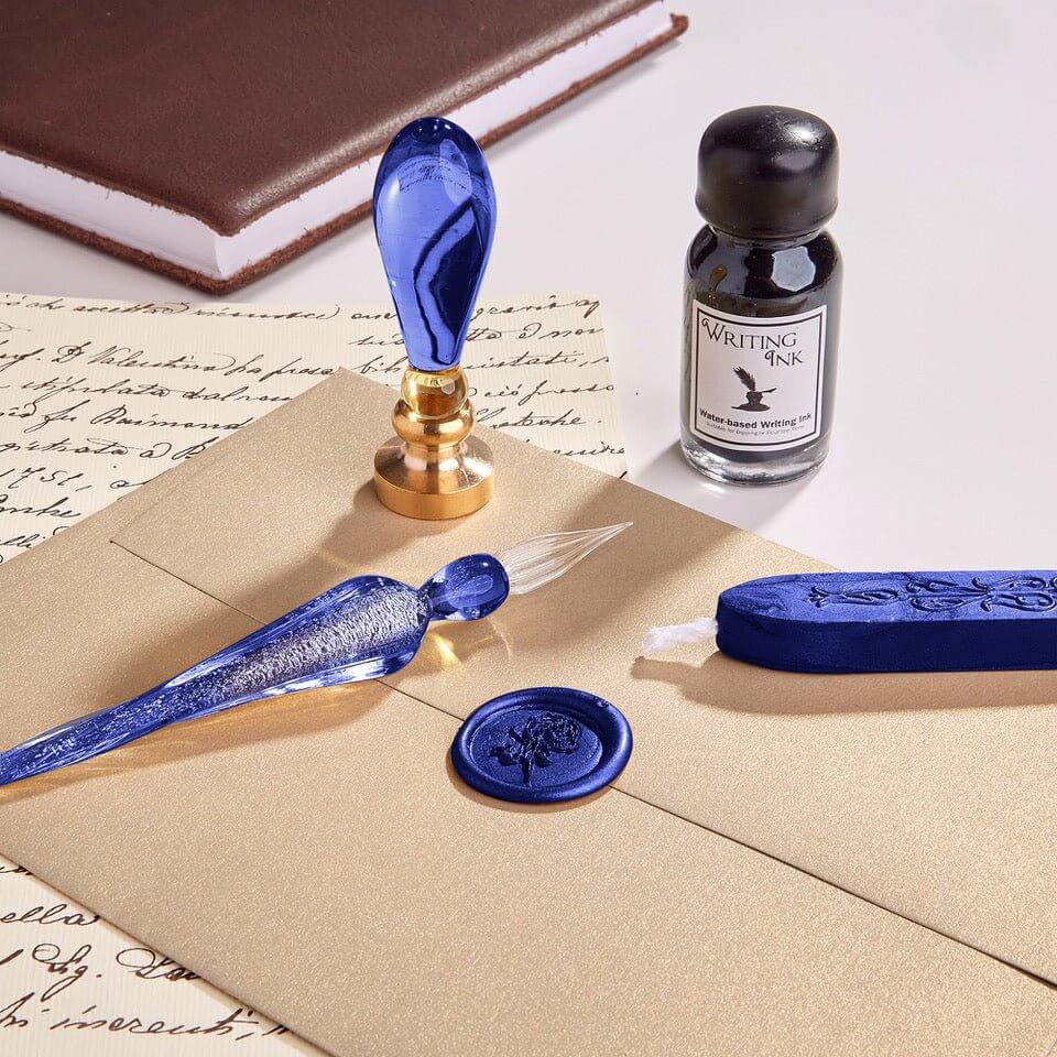 Blue wax seal set with ink bottle on a letter background