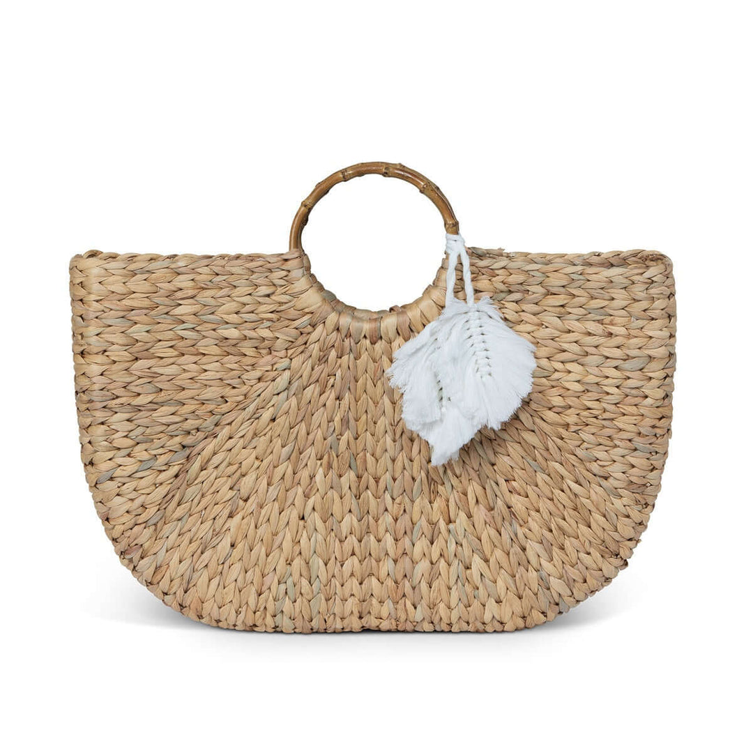 Boho Chic Handwoven Straw Tote Bag with circular handles and white tassel detail, showcasing artisanal craftsmanship.