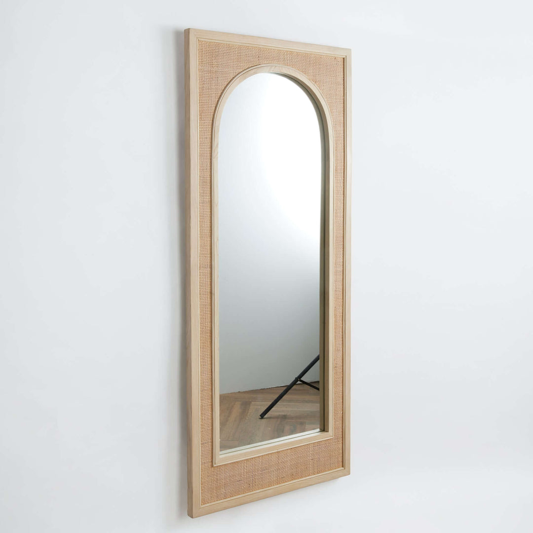 Tall arched boho rattan wall mirror with earthy texture, perfect for bohemian-style home decor.