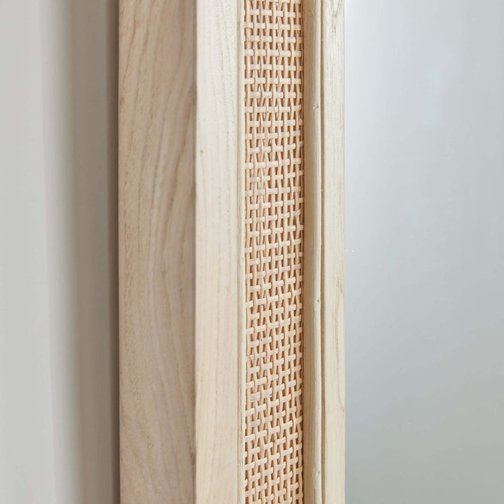 Close-up of the boho rattan wall mirror showcasing its natural wood frame and woven texture.