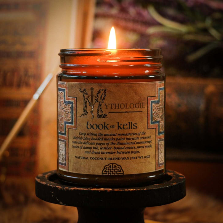 Book of Kells Candle with warm glow and intricate label design