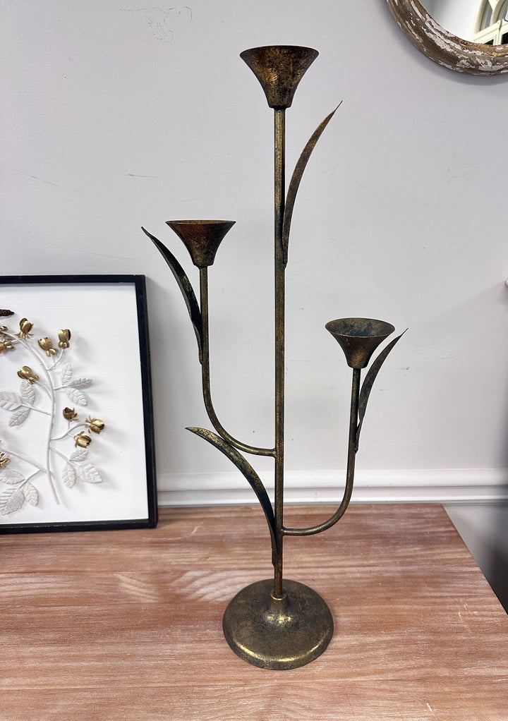 Large Botanical Iron Taper Candle Holder styled with three lit tapers
