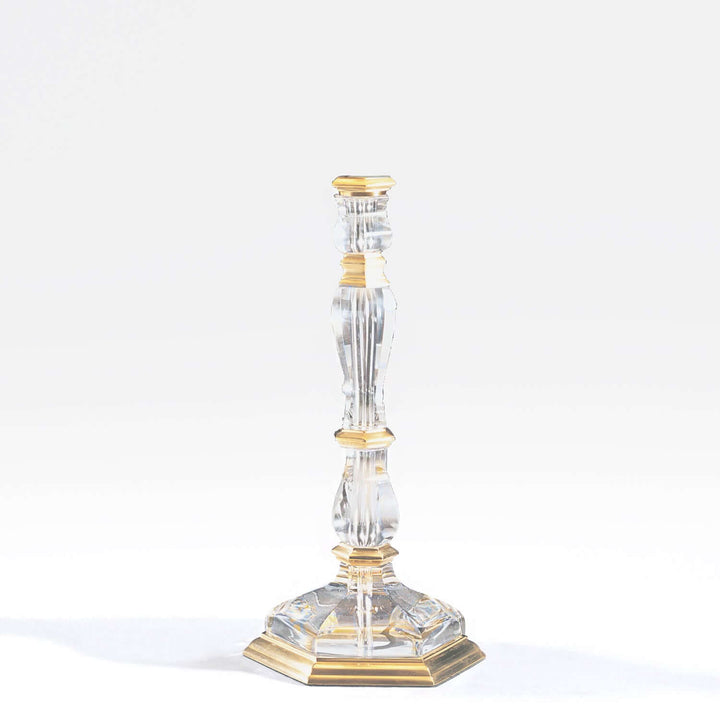Decorative candlestick with gold accents on a white background