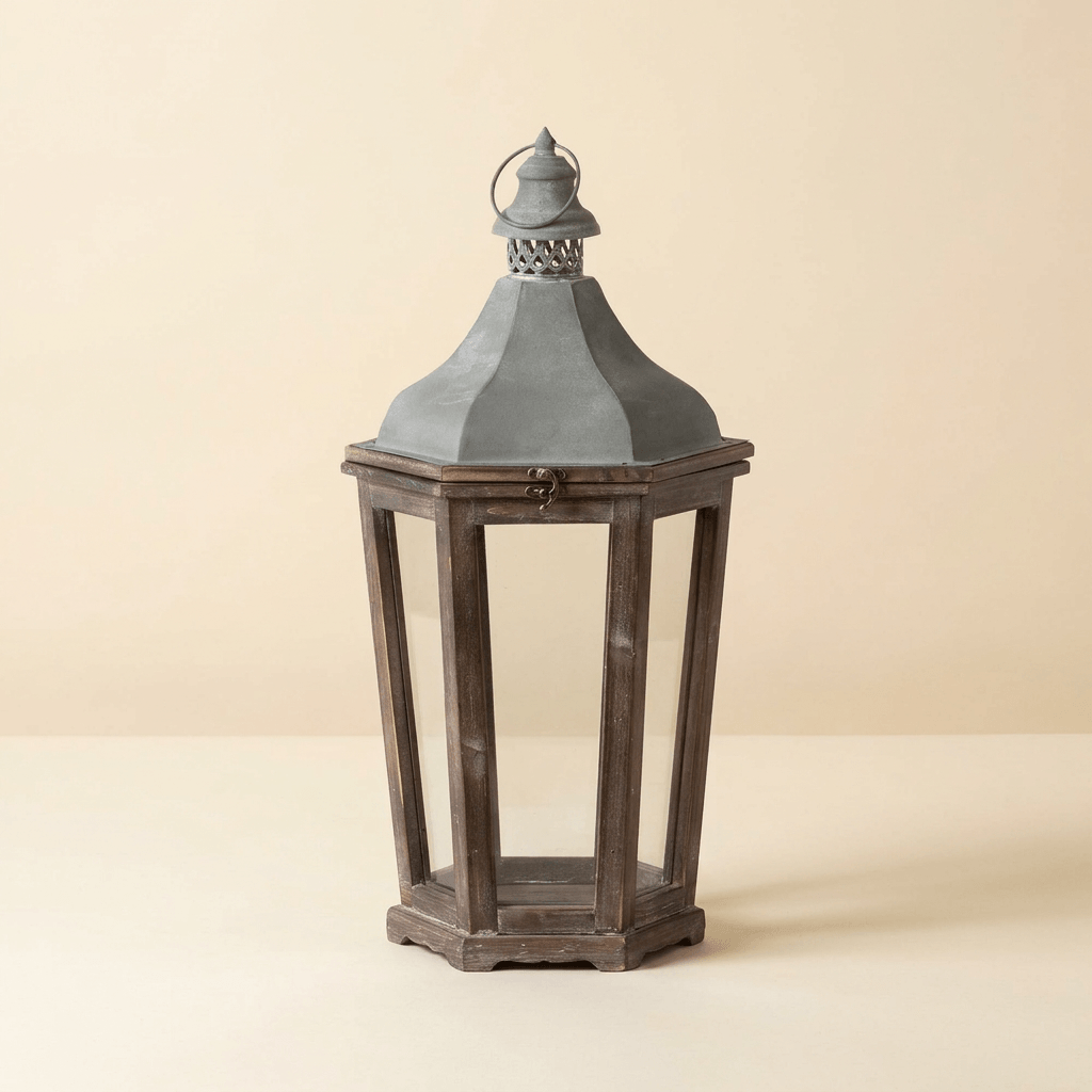 Medium Briarwick Carriage Lantern with aged wood frame and galvanized roof on a warm cream background