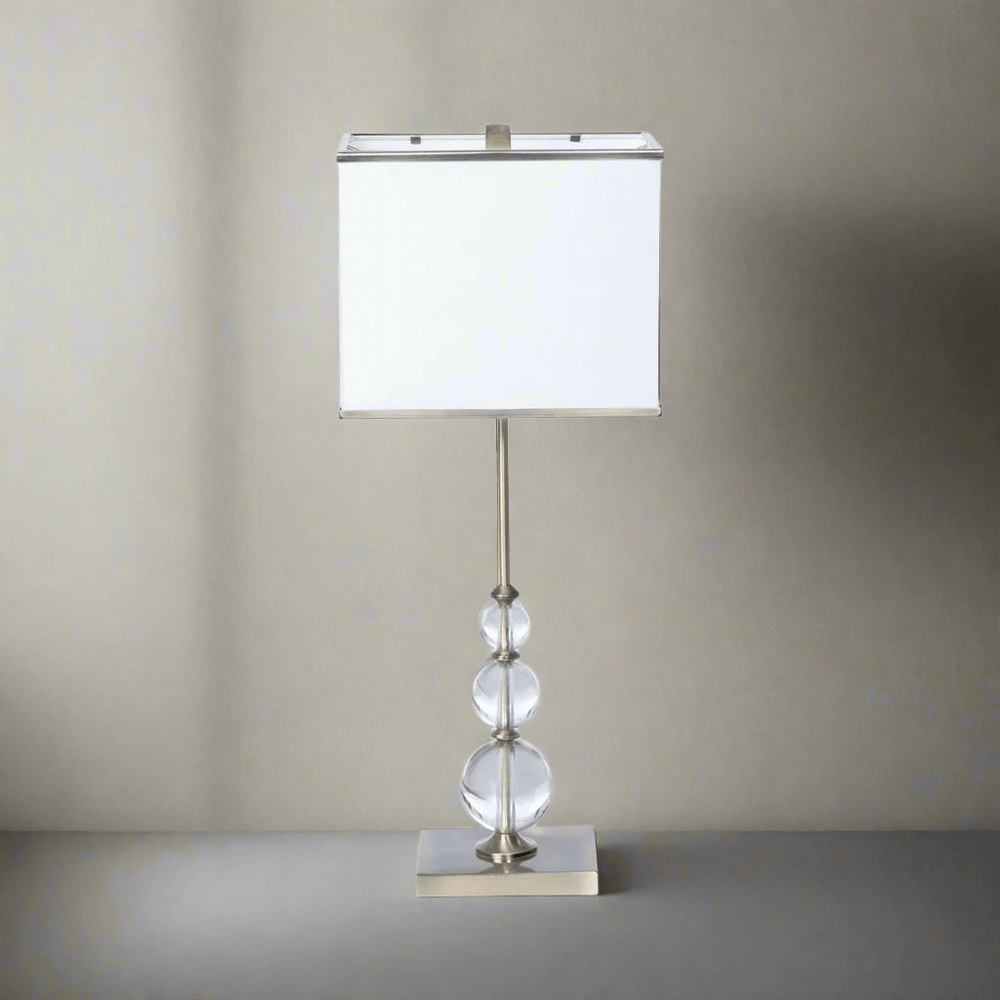 Buffet Lamp with Crystal Orbs and Brass Base exuding vintage glamour and sophistication with slender design and radiant crystals.