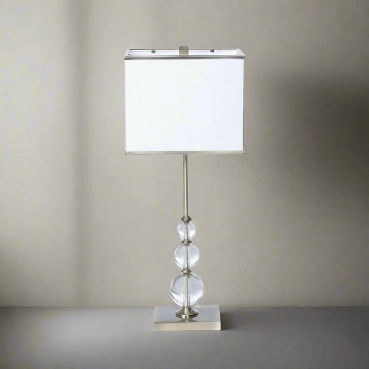 Buffet Lamp with Crystal Orbs and Brass Base exuding vintage glamour and sophistication with slender design and radiant crystals.