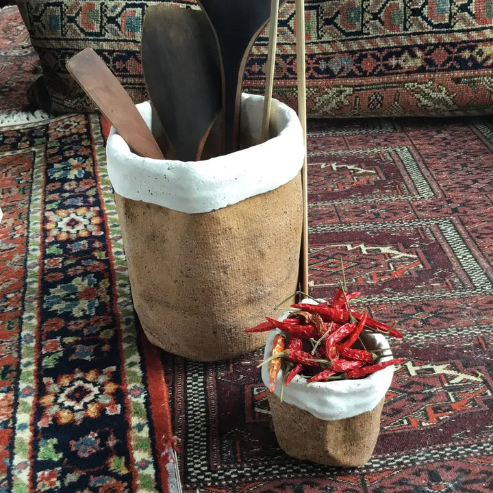 Tall Burlap-Textured Cement Bag Planter beside a smaller planted pot
