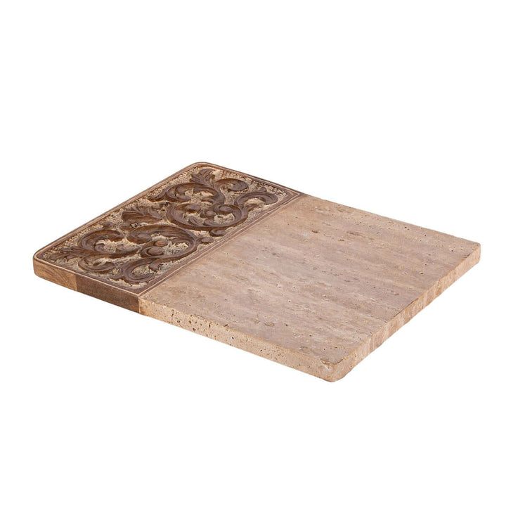 Carved wood and marble cutting board with ornate design, blending elegance and rustic charm, perfect for kitchen displays and function.
