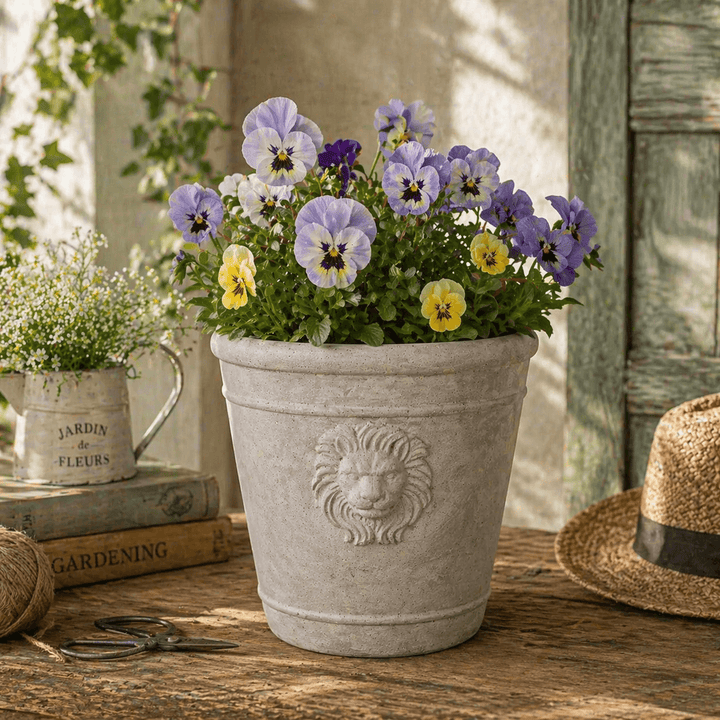 Stacked Cast Cement Lion Head Planters showing classical relief detail