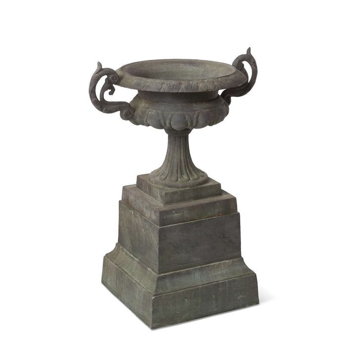 Cast Iron Garden Urn on Plinth with Scroll Handles in classical design, showcasing timeless elegance for gardens and courtyards.
