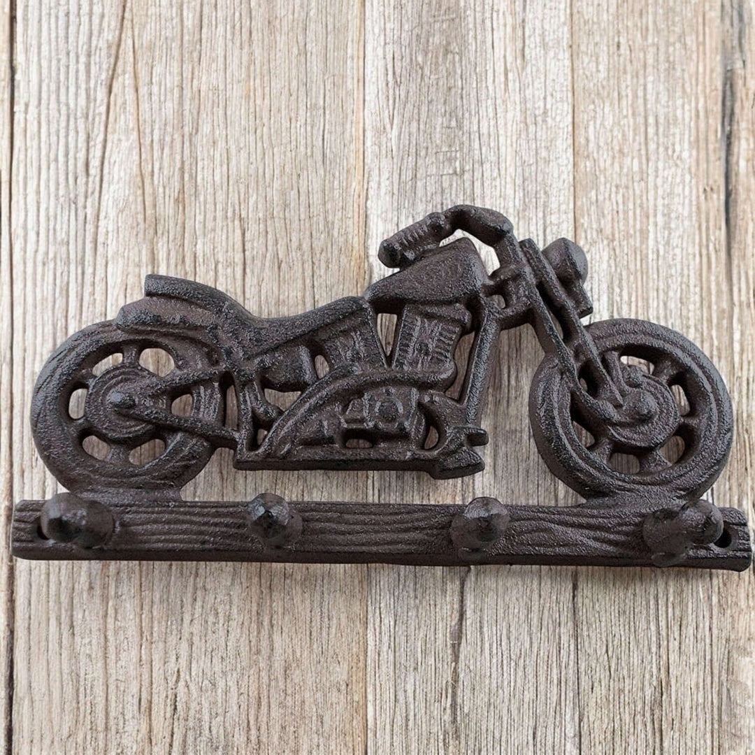 Cast Iron Motorcycle Wall Hook on wooden background, featuring a detailed motorcycle design with multiple hooks for hanging.