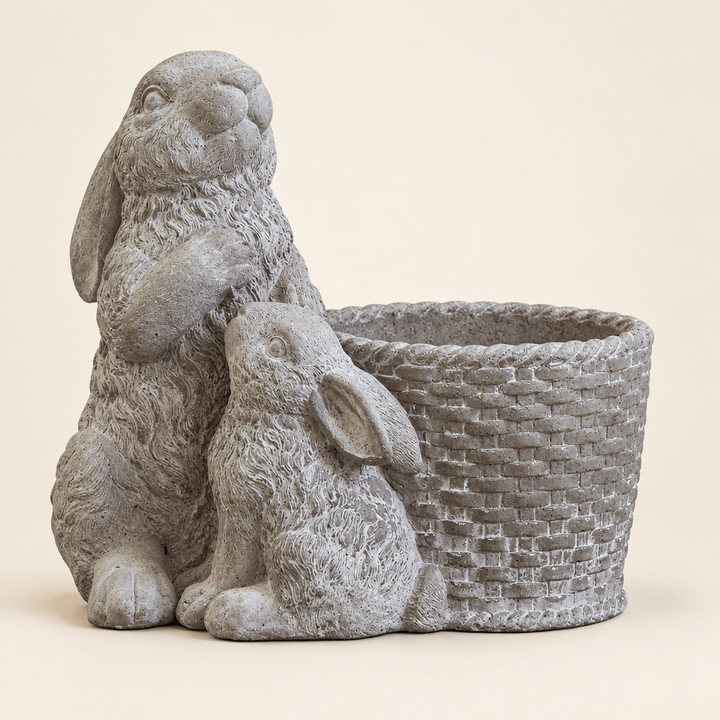 Gray cement double rabbit basket planter on an ivory studio background