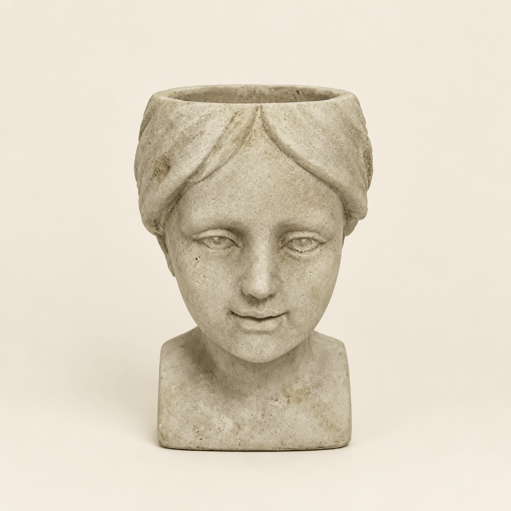 Cement Girl Head Planter on a warm ivory studio background