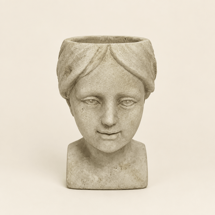 Cement Girl Head Planter on a warm ivory studio background