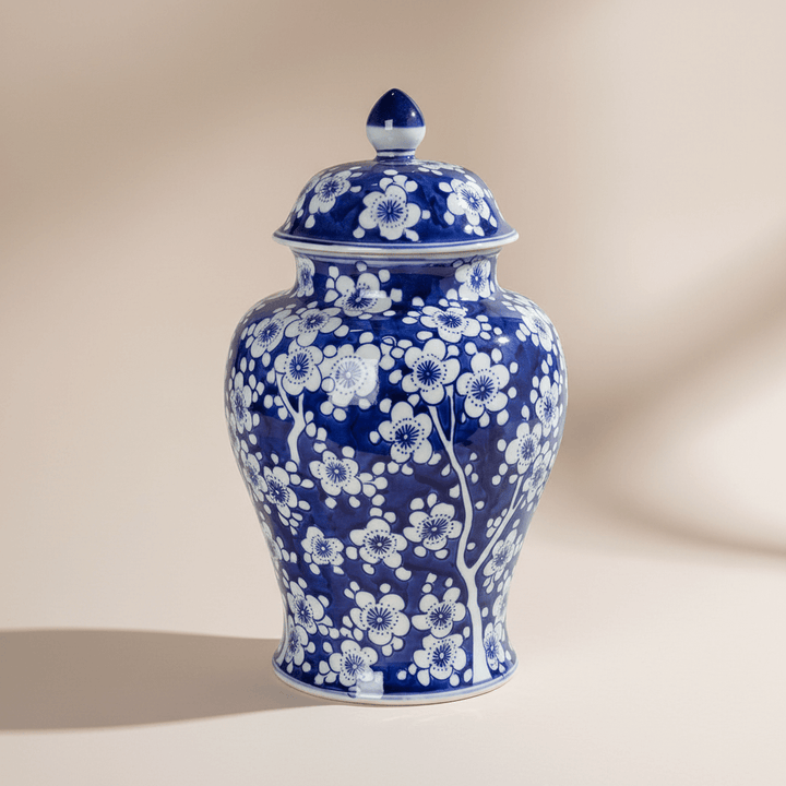 Chinoiserie Blue and White Floral Ginger Jar in elegant porcelain with intricate floral patterns.