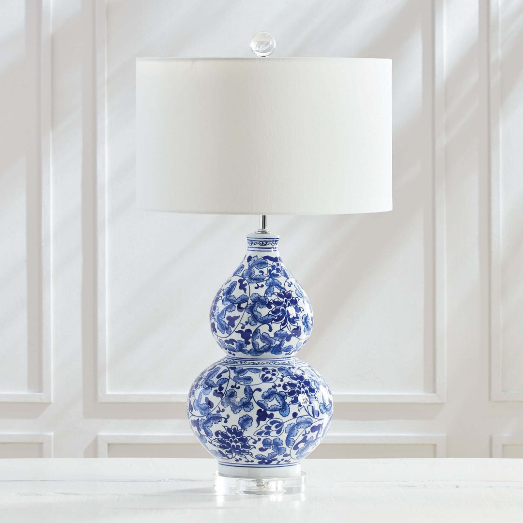 Chinoiserie double gourd table lamp with hand-painted cobalt blue floral design and white shade.