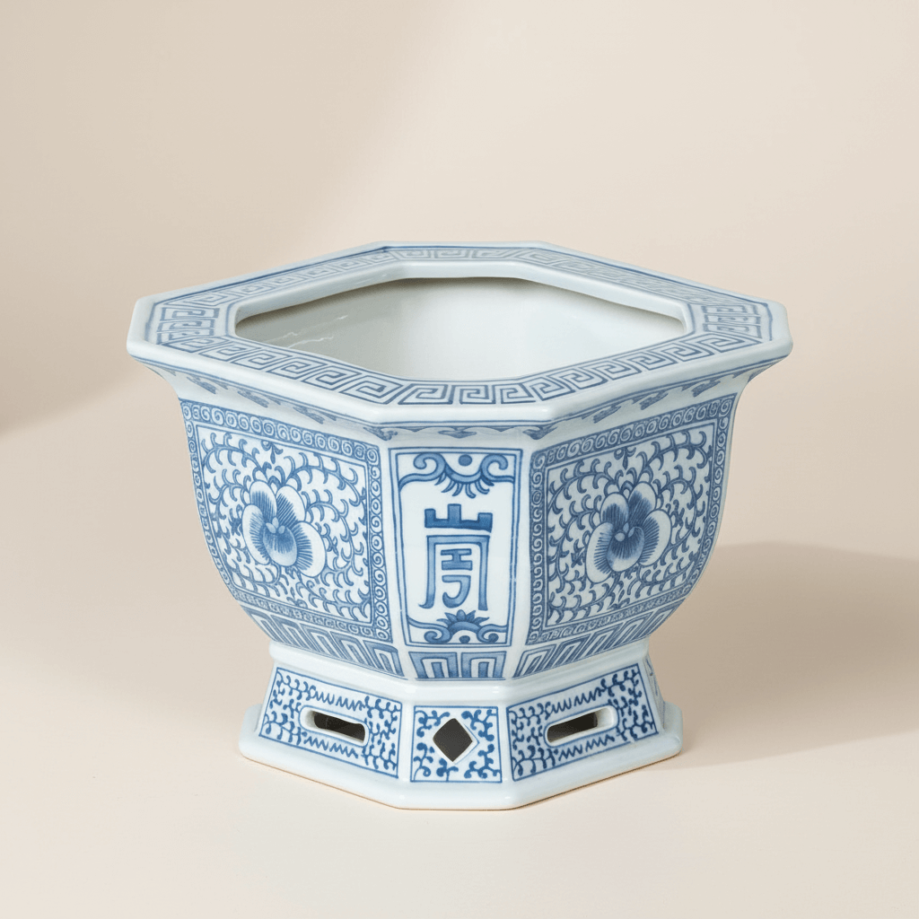 Chinoiserie Blue and White Porcelain Planter with intricate cobalt designs and a hexagonal shape, showcasing traditional elegance.