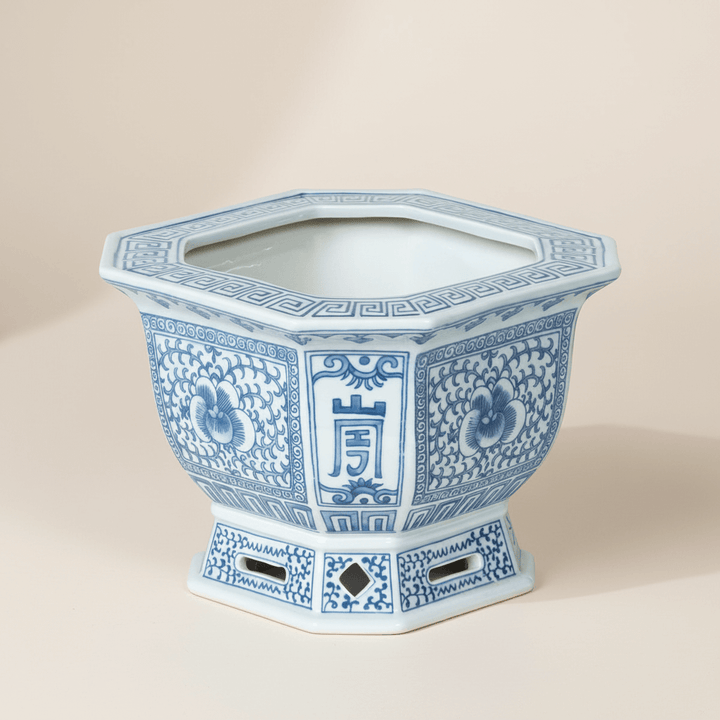 Chinoiserie Blue and White Porcelain Planter with intricate cobalt designs and a hexagonal shape, showcasing traditional elegance.