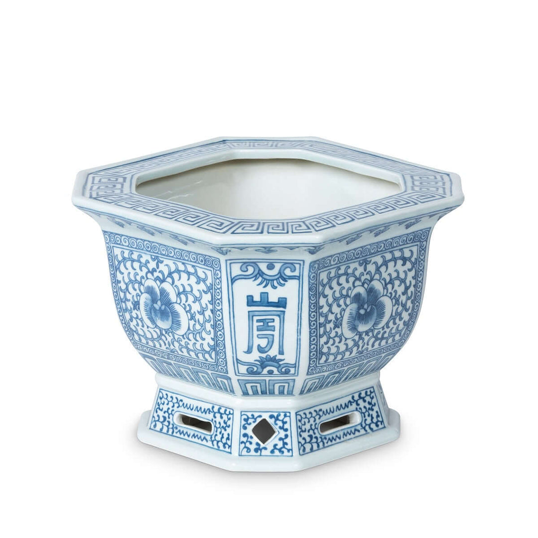 Chinoiserie Blue and White Porcelain Planter with intricate blue floral designs and an octagonal shape, highlighting timeless elegance.