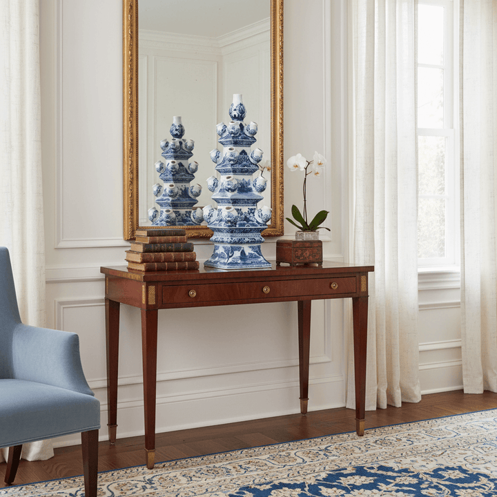 Chinoiserie Blue and White Tulip Vase displayed on a wooden table with a mirror backdrop and elegant room decor.