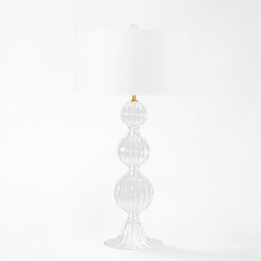 Decorative Murano glass table lamp with a white shade on a white background
