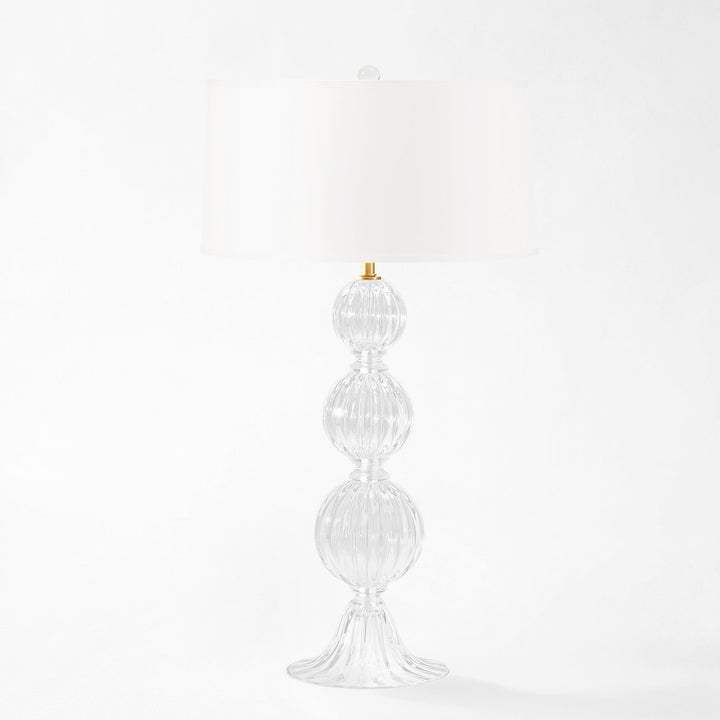 Decorative Murano glass table lamp with a white shade on a white background